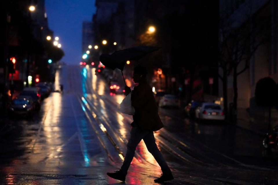 A person walks across California Street in San Francisco on Wednesday, Jan. 4, 2023. Another winter storm moved into California on Wednesday (Copyright 2022 The Associated Press. All rights reserved)