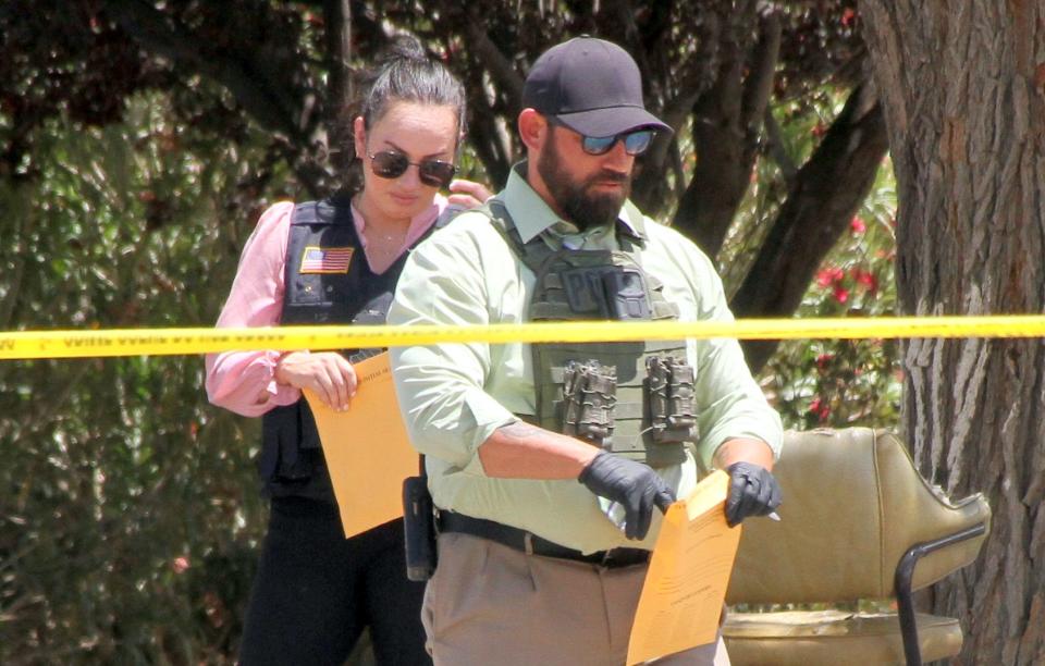 Deming police investigators collected evidence at the Deming Manor Apartments on Monday.
(Photo: Bill Armendariz - Headlight Photo)