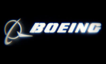 FILE PHOTO: The Boeing Company logo is projected on a wall at the "What's Next?" conference in Chicago, Illinois, U.S., October 4, 2016. REUTERS/Jim Young/File Photo