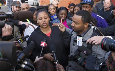 Nailah Winkfield, the mother of Jahi McMath, along with Jahi's uncle Omari Sealy (R), speak with the media outside Children's Hospital and Research Center in Oakland, California, December 30, 2013. REUTERS/Norbert von der Groeben