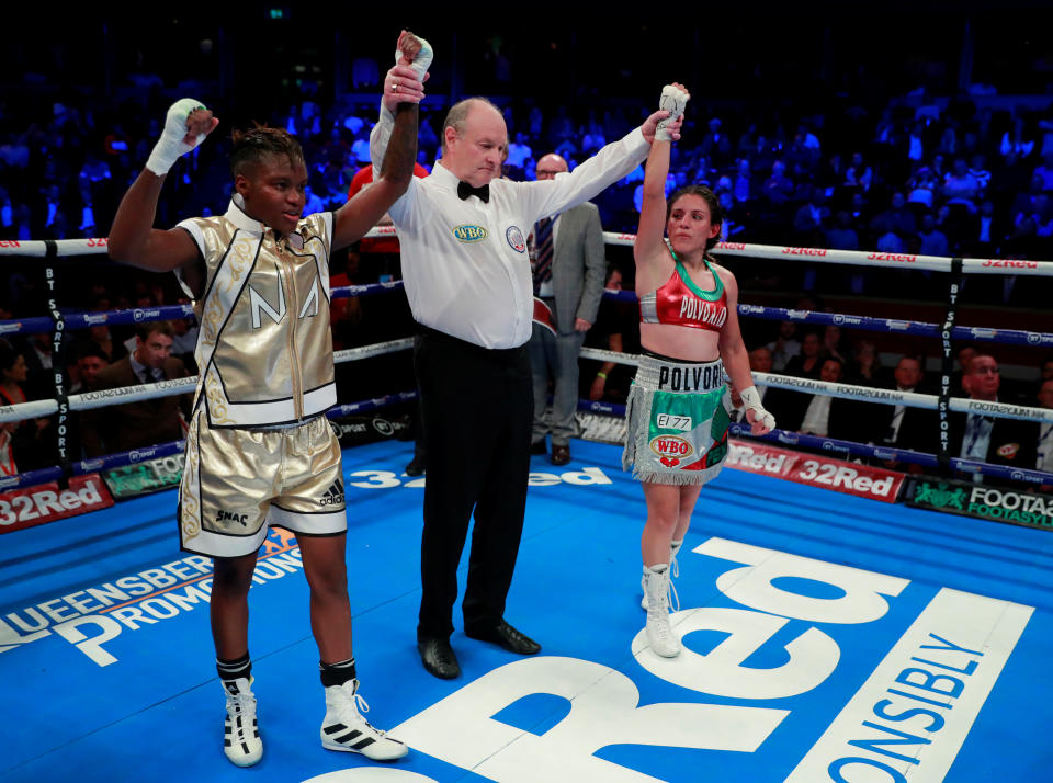 Nicola Adams and Maria Salinas as the referee declares their world title fight a draw at the Royal Albert Hall