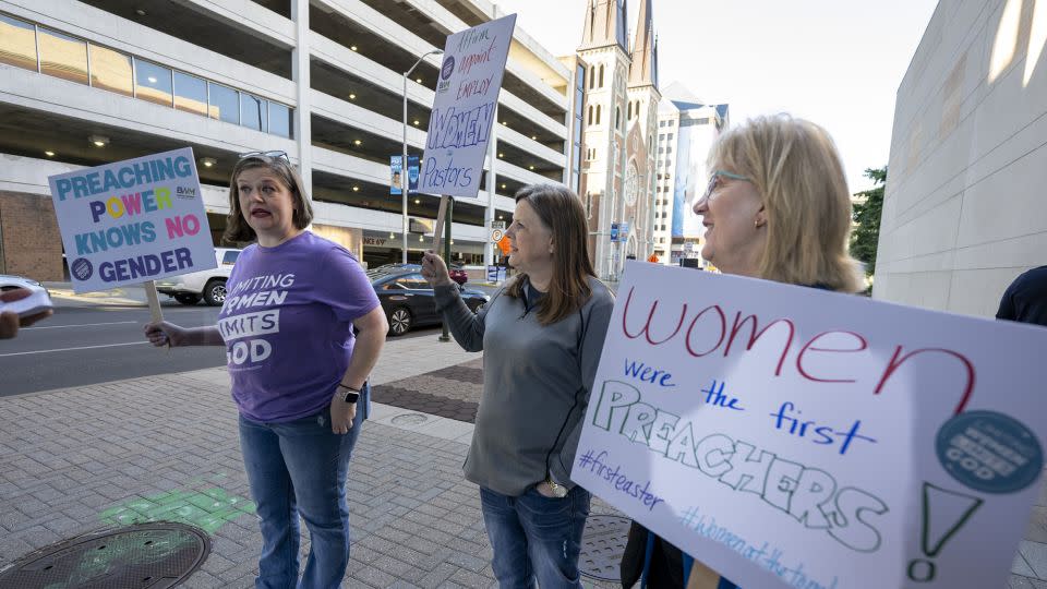 Nikki Hardeman, of Atlanta, an advocacy director for Baptist Women in Ministry, left, Meredith Stone, executive director of Baptist Women in Ministry, center, and Christa Brown, an advocate for survivors of sexual abuse and a supporter of the Baptist Women in Ministry, protest outside the venue of a Southern Baptist Convention annual meeting on June 11, 2024, in Indianapolis. - Doug McSchooler/AP