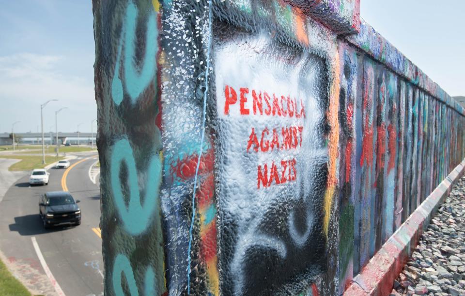 “Pensacola Against Nazis” messages are visible on Graffiti Bridge in Pensacola on Tuesday, Aug. 15, 2023. Volunteers from the Party for Socialism & Liberation-Central Gulf Coast, PensaPride, Strive (Socialist Trans Initiative) and other members of the community painted over Nazi graffiti and added these messages on Sunday, August 13.