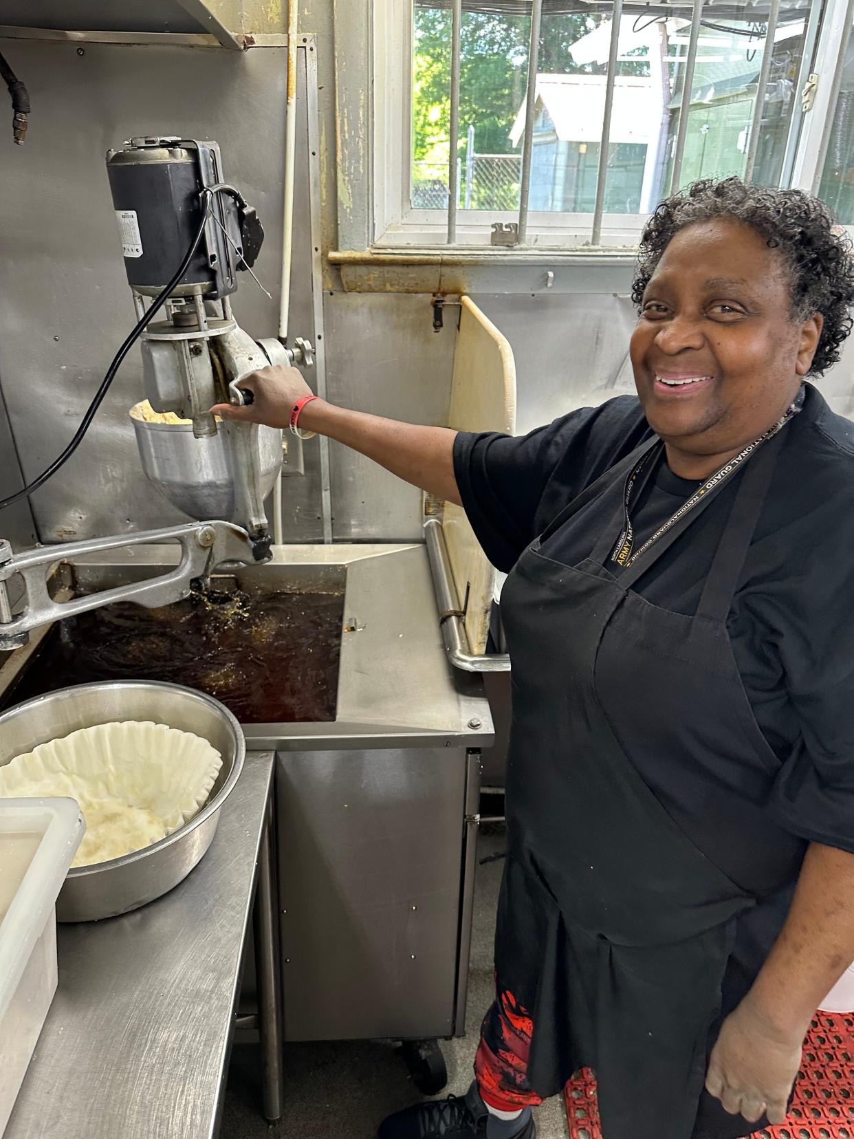 Delia Livsey prepares a fresh batch of hushpuppies. She has been making the Southern treat for 40 years at Red Bridge's Barbecue Lodge.