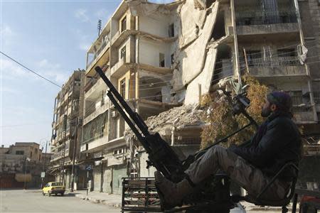 A Free Syrian Army fighter mans an anti-aircraft weapon in Maysar neighbourhood of Aleppo December 28, 2013. REUTERS/Jalal Alhalabi