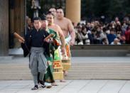 Mongolian-born grand sumo champion Yokozuna Harumafuji (R) arrives for performing the New Year's ring-entering rite at the annual celebration for the New Year at Meiji Shrine in Tokyo, Japan, January 6, 2017. REUTERS/Issei Kato