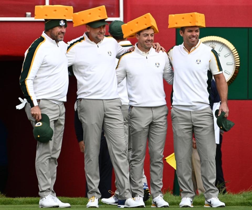 Team Europe’s Lee Westwood, Ian Poulter, Rory McIlroy and Paul Casey (left-right) arrive on the first tee wearing Green Bay Packers cheesehead hats ahead of the 43rd Ryder Cup (Anthony Behar/PA) (PA Wire)