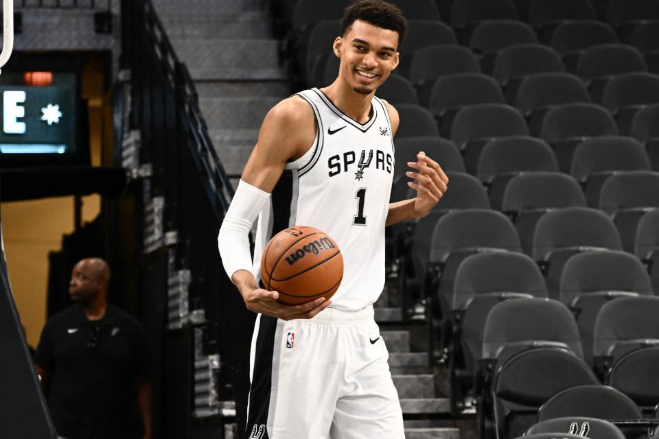 French basketball player Victor Wembanyama demonstrates his skills following a news conference introducing the Spurs 2023 Draft Class, at the AT&T Center in San Antonio, Texas, on June 24, 2023. (Photo by Patrick T. Fallon / AFP) (Photo by PATRICK T. FALLON/AFP via Getty Images)