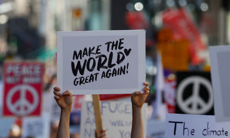 People attend 'Helsinki Calling' protest ahead of meeting between the U.S. President Donald Trump and Russian President Vladimir Putin in Helsinki, Finland July 15, 2018. REUTERS/Leonhard Foeger