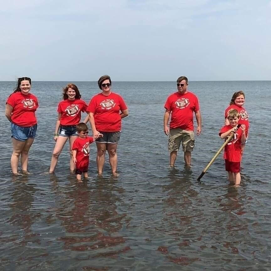 The Carlson family standing in the Great Salt Lake in Utah in 2018. The family was visiting for Joe, pictured holding hands with Andrea, to participate in the Transplant Games of America. The event is held every four years, much like the Olympics.