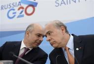 Angel Gurria (R), secretary-general of the Organisation for Economic Co-operation and Development (OECD), and Anton Siluanov, Russia's Finance Minister, attend a briefing at the G20 Summit in Strelna near St. Petersburg, September 5, 2013. REUTERS/Roman Yandolin/RIA Novosti/Pool