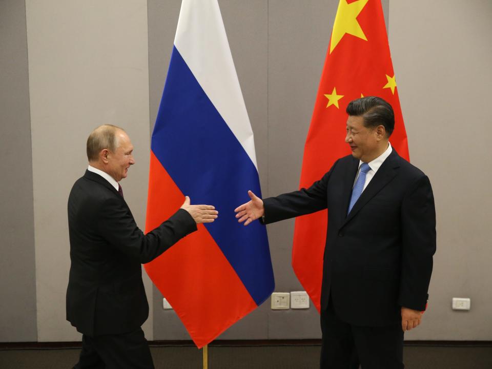 Russian President Vladimir Putin meets Chinese President Xi Jinping at BRICS Summit in Brasilia