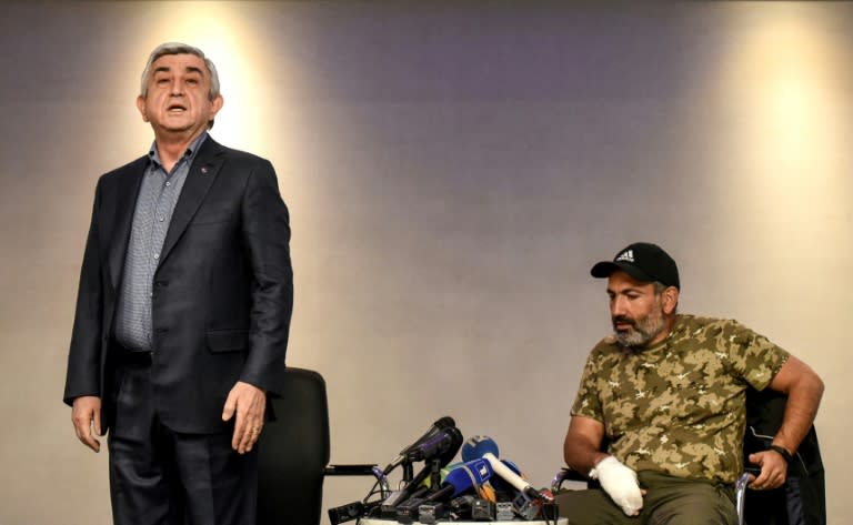 Armenian Prime Minister Serzh Sarkisian (left) stormed out of a tense televised debate with opposition leader Nikol Pashinyan on Sunday