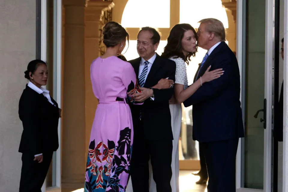 John Paulson and Alina de Almeida greet Melania Trump and Donald Trump