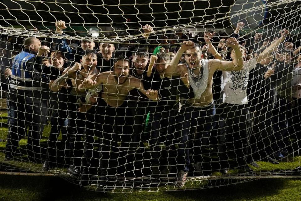 Mansfield fans celebrate at full-time.