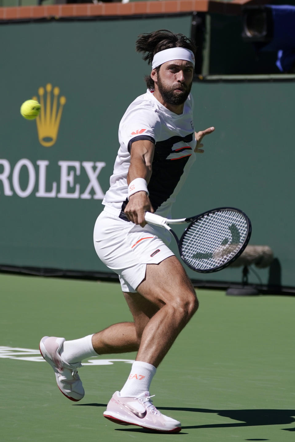 Nikoloz Basilashvili, of Georgia, returns to Stefanos Tsitsipas, of Greece, at the BNP Paribas Open tennis tournament Friday, Oct. 15, 2021, in Indian Wells, Calif. (AP Photo/Mark J. Terrill)