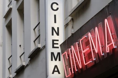 Cinema neon light signs are seen at the entrance of Le Beverley adult cinema in Paris July 30, 2014. REUTERS/Christian Hartmann