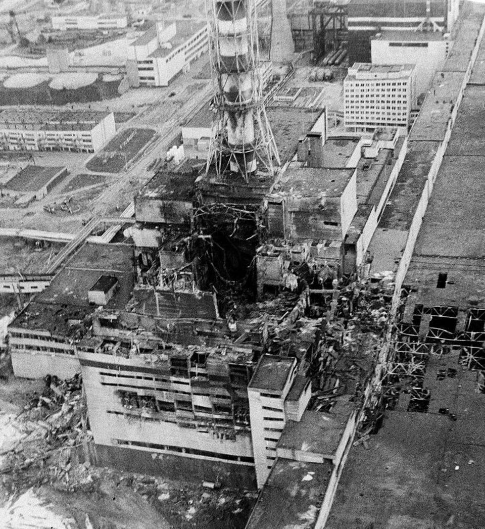 An aerial view of the Chernobyl nucler power plant, the site of the world's worst nuclear accident, seen in this April 1986 file photo made two to three days after the explosion in Chernobyl, Ukraine. In front of the chimney is the destroyed 4th reactor.
