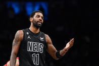 Brooklyn Nets guard Kyrie Irving (11) gestures during the first half of the team's NBA basketball game against the Toronto Raptors on Friday, Dec. 2, 2022, in New York. (AP Photo/Eduardo Munoz Alvarez)