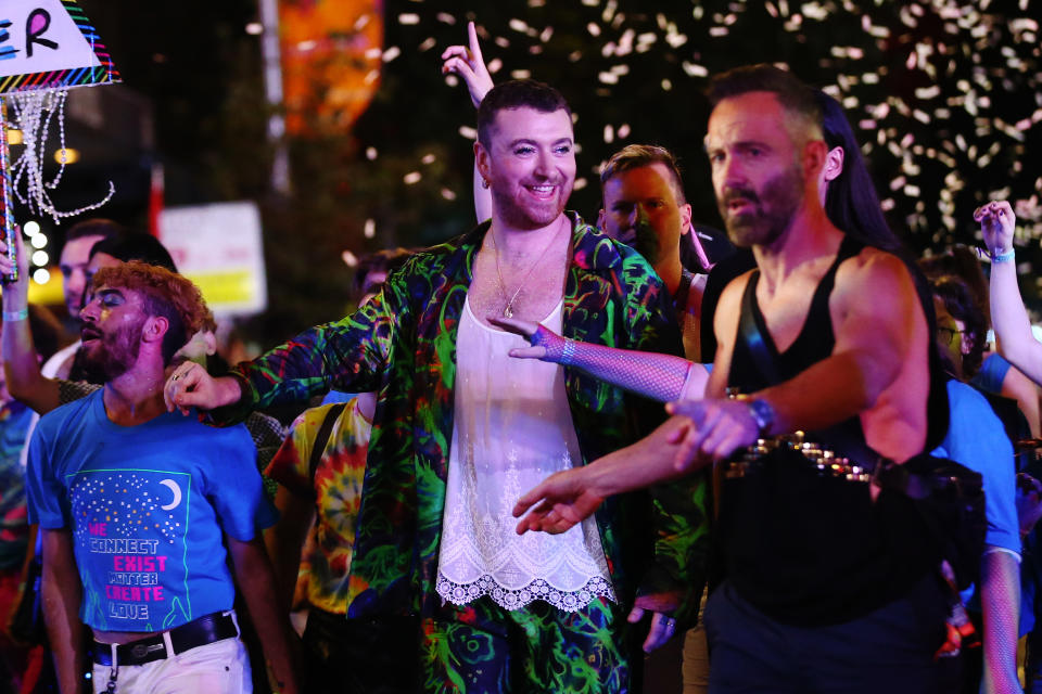 Sam Smith was seen before their performance enjoying the parade. (Getty Images)