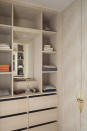 <p> Small rooms may be limited in size but they can be big on style. 'Tucked neatly within the custom cabinetry of this walk-in closet are a small mirror and shelf space with spot lighting, making a compact vanity unit space that is discreet and convenient,' says Katie Lion, senior interior designer at Kitesgrove.  </p>