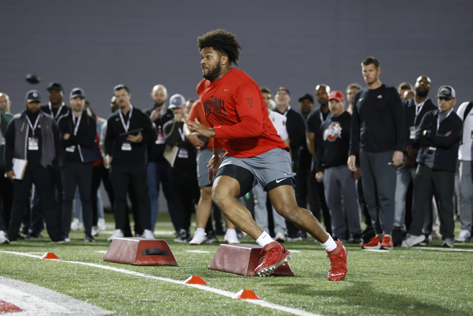 Ohio State football offensive tackle Paris Johnson Jr. runs a drill at the school's NFL Pro Day in Columbus, Ohio, Wednesday, March 22, 2023. (AP Photo/Paul Vernon)