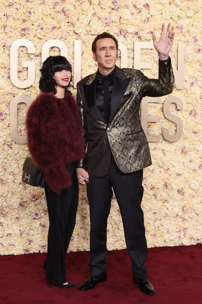 Riko Shibata and Nicolas Cage attend the 81st Annual Golden Globe Awards at The Beverly Hilton on January 07, 2024 in Beverly Hills, California.