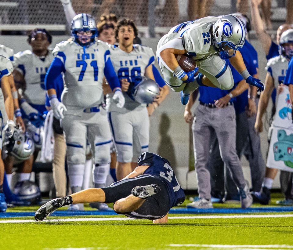 Georgetown running back Andrew Petter hurdles Hendrickson kicker Divan De Kock on a kickoff return Thursday. Petter ran for 164 yards and four touchdowns while finishing with more than 250 all-purpose yards.