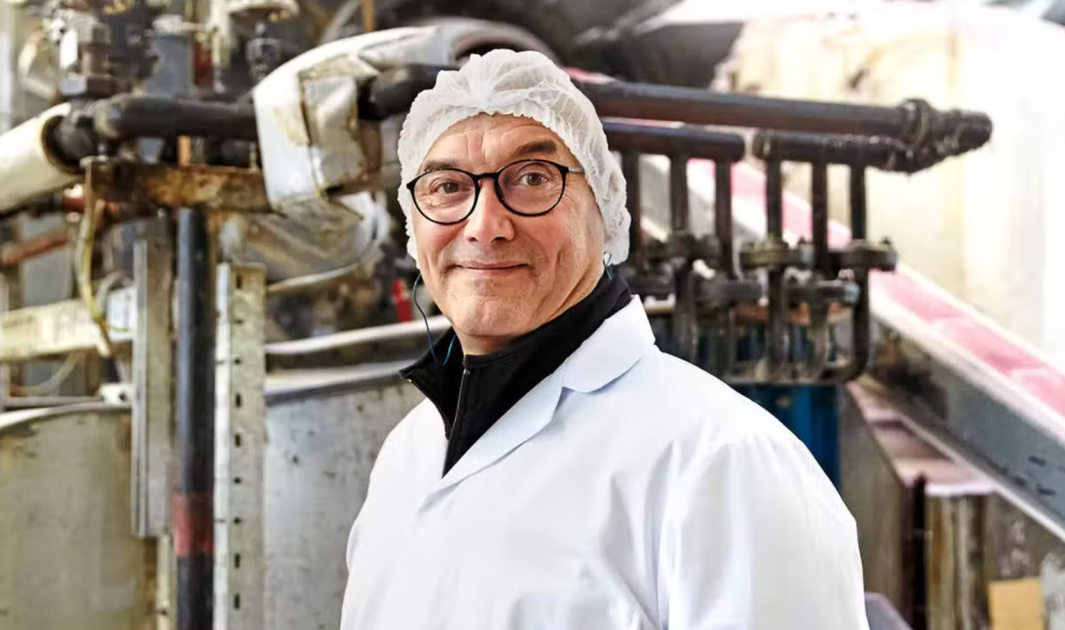 gregg wallace on inside the factory, in a hair net and white coat