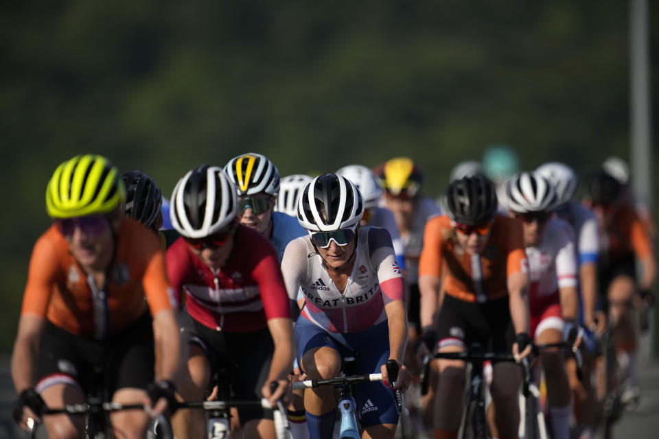 Riders compete during the women's cycling road race at the 2020 Summer Olympics, Sunday, July 25, 2021, in Oyama, Japan. (AP Photo/Christophe Ena)