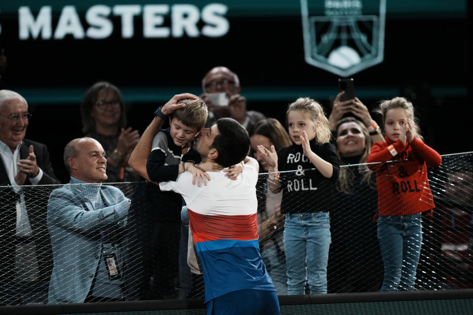 Serbia's Novak Djokovic kisses his son Stefan after defeating Russia's Daniil Medvedev during the final match of the Paris Masters tennis tournament at the Accor Arena in Paris, Sunday, Nov.7, 2021. Djokovic won 4-6, 6-3, 6-3. (AP Photo/Thibault Camus)