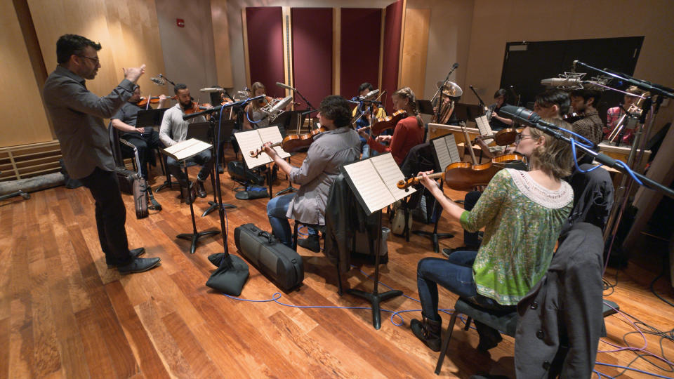This Nov. 7, 2018, photo provided by the University of Michigan shows the Contemporary Directions Ensemble under the direction of Professor Oriol Sans in Ann Arbor recording "The Most Beautiful Time of Life" _ as it's translated from German to English. The music has not been heard since it was arranged and performed by prisoners in a World War II death camp. The ensemble will perform the piece Friday, Nov. 30, 2018, during a free on-campus concert. The handwritten manuscript was discovered by university music theory professor Patricia Hall while doing research at the Auschwitz-Birkenau Museum in Poland. (Christopher Boyes/University of Michigan via AP)