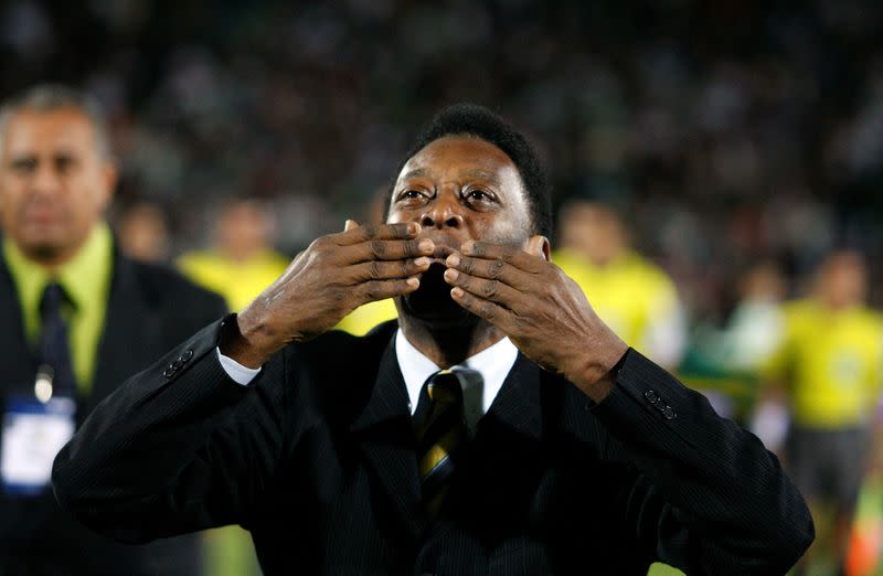 FILE PHOTO: Former Brazilian soccer star Pele acknowledges the fans during the opening ceremony of the Territorio Santos Modelo stadium in Torreon