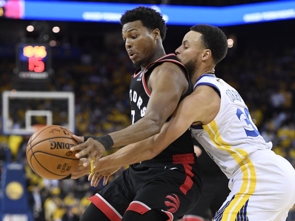 Golden State Warriors guard Stephen Curry (30) defends against Toronto Raptors guard Kyle Lowry (7) during the second half of Game 3 of basketball’s NBA Finals, Wednesday, June 5, 2019, in Oakland, Calif. (Frank Gunn/The Canadian Press via AP)