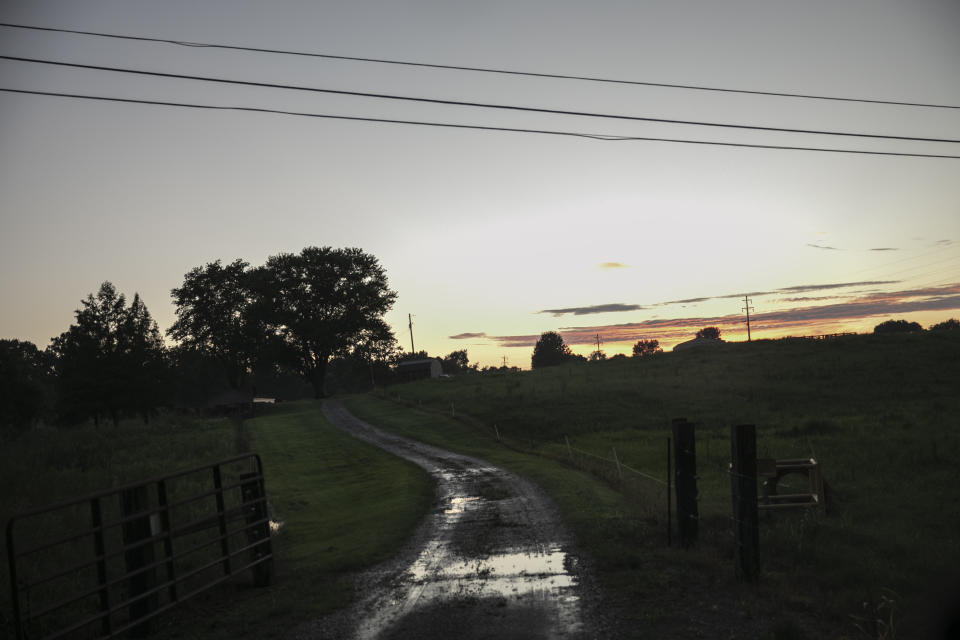 The sun sets over a field outside of Anna, Ill., on Saturday, Aug. 1, 2020. "Sundown towns" like Anna were places where Black people were allowed in during the day to work or shop but had to be gone by nightfall. Today, some still exist in various forms, enforced now by tradition and fear rather than by rules. (AP Photo/Wong Maye-E)