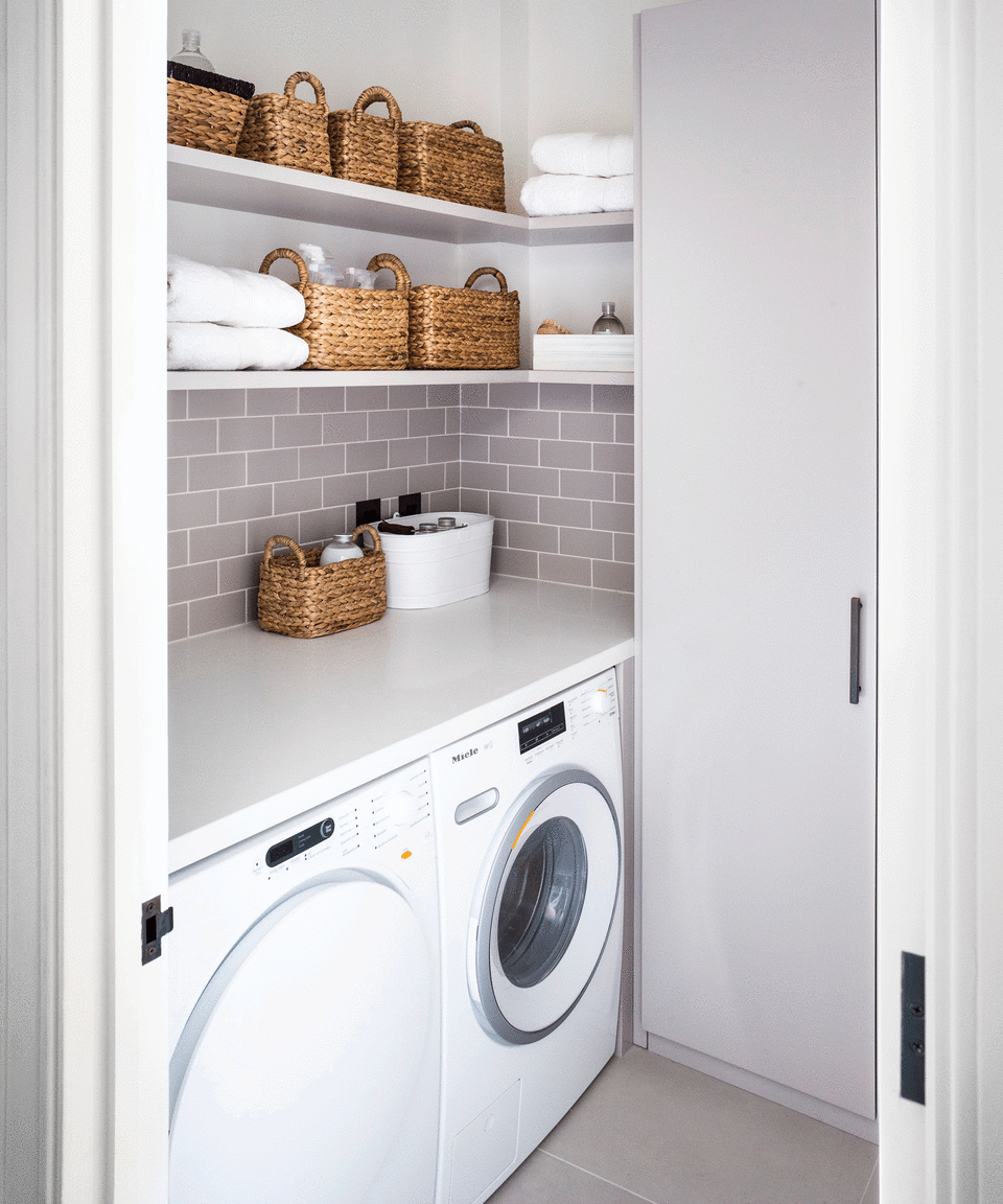 White utility room with washing machine