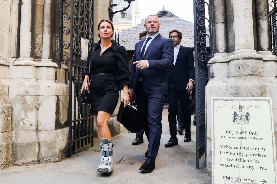 Coleen and Wayne Rooney leave court (Getty Images)