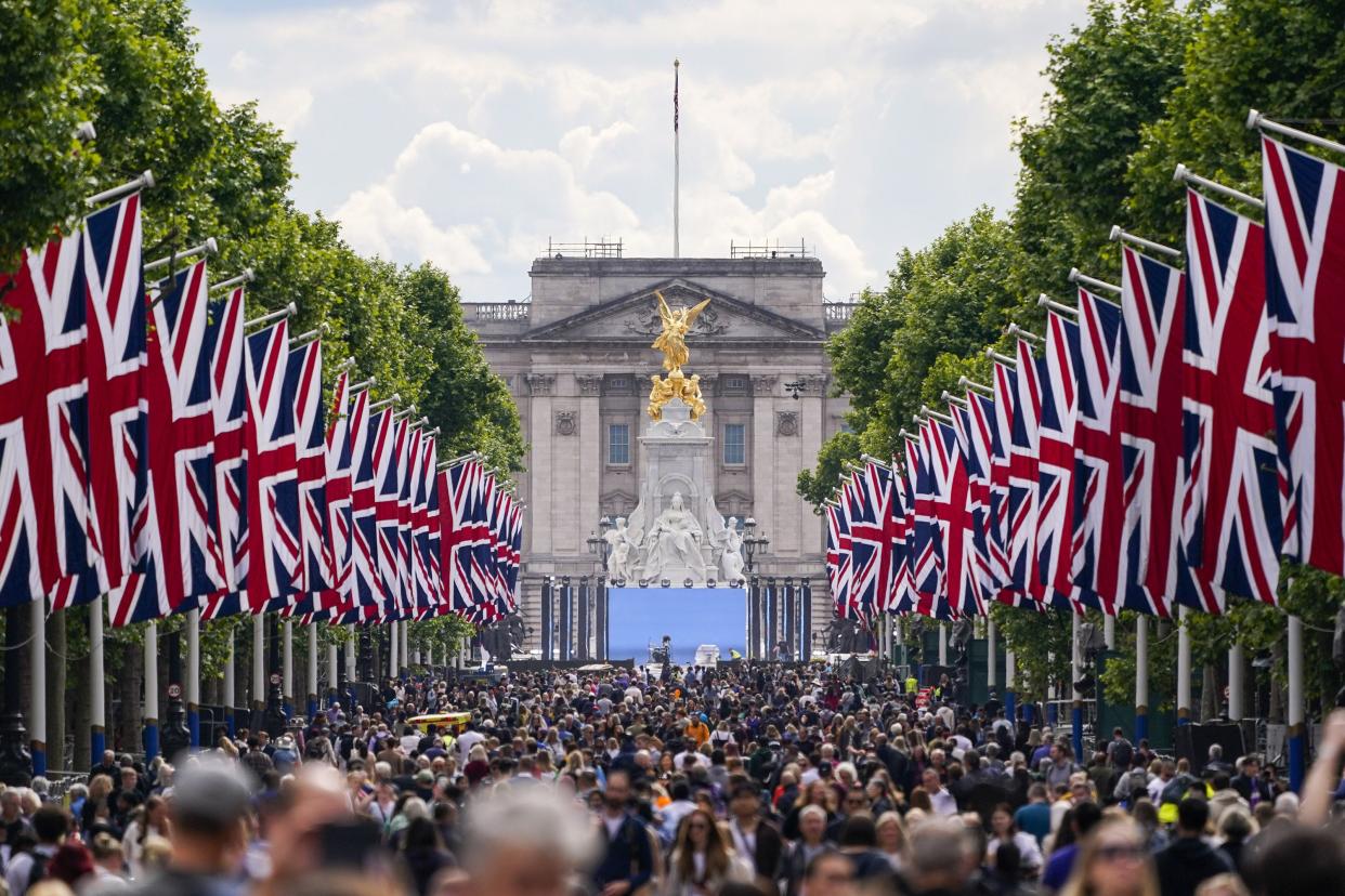 People walk along The Mall in London on Wednesday, June 1, 2022, ahead of the start of the Queen's Jubilee weekend.