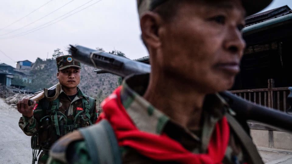 In this photo taken on March 9, 2023 members of ethnic rebel group Ta'ang National Liberation Army (TNLA) patrol near Namhsan Township in Myanmar's northern Shan State. - Stringer/AFP/Getty Images