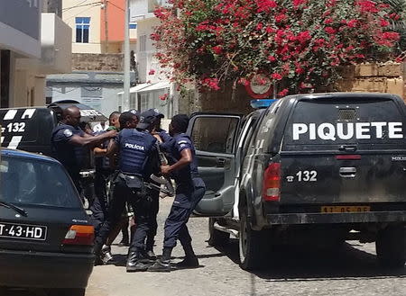 Police arrest the suspected gunman who killed 11 people in a shooting on Tuesday in Praia, Cape Verde, April 27, 2016. REUTERS/Julio Rodrigues EDITORIAL USE ONLY. NO RESALES. NO ARCHIVE. TPX IMAGES OF THE DAY