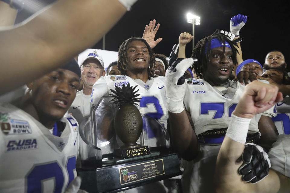 Middle Tennessee players react after winning the Hawaii Bowl NCAA college football game against San Diego State, Saturday, Dec. 24, 2022, in Honolulu. (AP Photo/Marco Garcia)