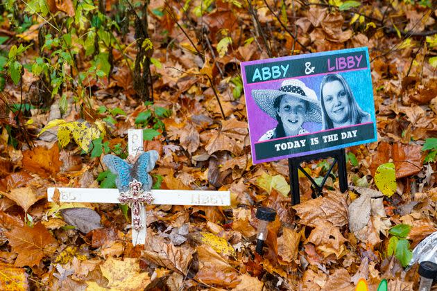 A makeshift memorial to Libby German and Abby Williams near where they were last seen and where the bodies were discovered stands along the Monon Trail leading to the Monon High Bridge Trail in Delphi, Indiana, on Oct. 31, 2022.