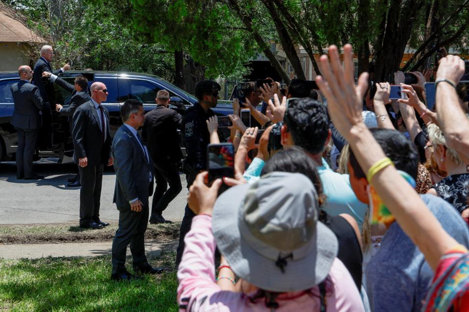 People watch as U.S. President Joe Biden leaves the Sacred Heart Catholic Church after attending mass following a visit to pay his respects at a memorial at Robb Elementary School (REUTERS)