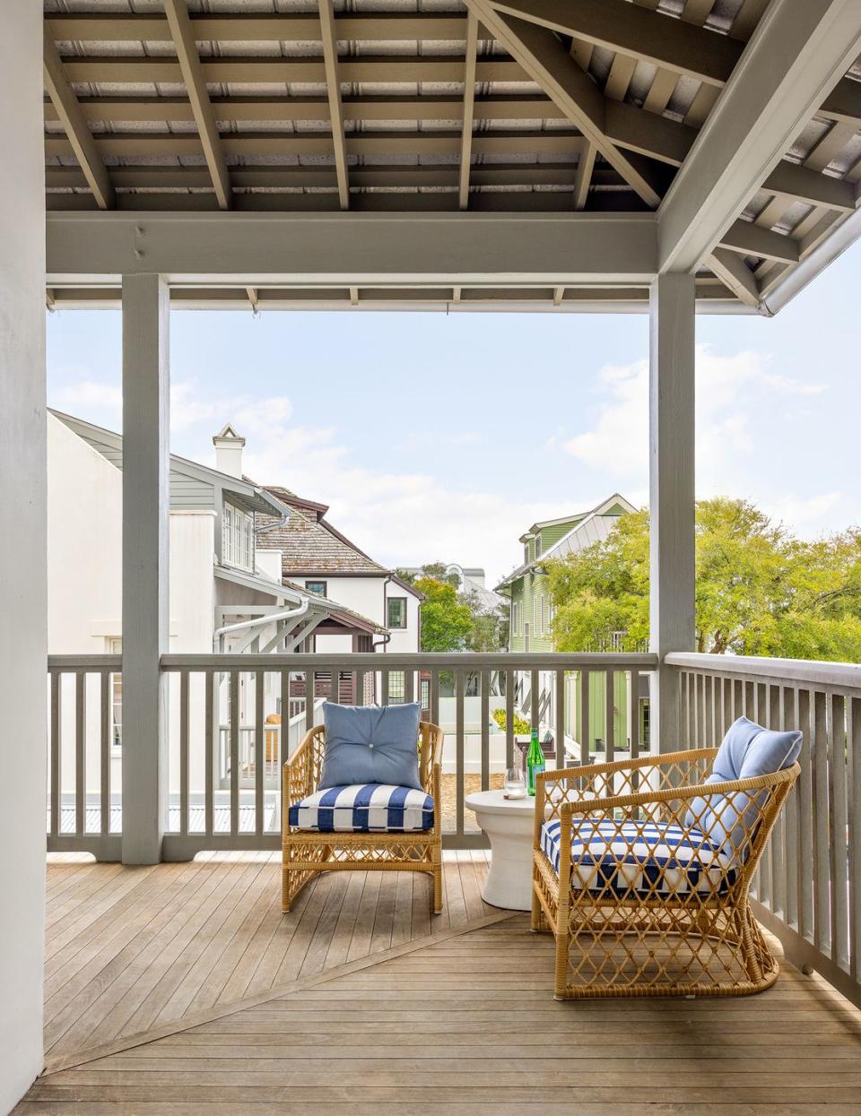 a deck with a chair and a table on it