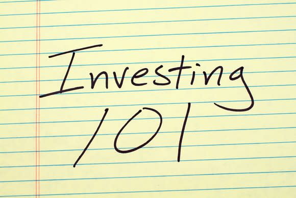 yellow lined paper, on which is written investing 101