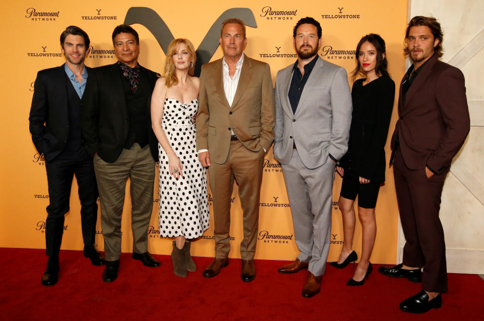 Wes Bentley, Gil Birmingham, Kelly Reilly, Kevin Costner, Cole Hauser, Kelsey Asbille and Luke Grimes pose at a premiere party for Yellowstone season 2 in 2019. 