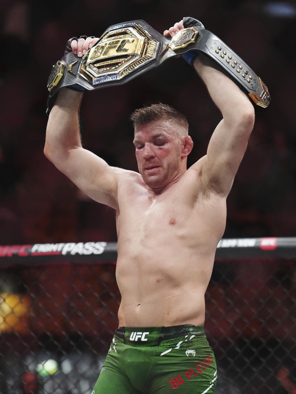 Dricus Du Plessis celebrates after defeating Sean Strickland in a middleweight title bout during the UFC 297 mixed martial arts event in Toronto early Sunday, Jan. 21, 2024. (Nathan Denette/The Canadian Press via AP)