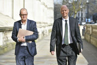 England's Chief Medical Officer Chris Whitty, right, and Chief Scientific Adviser Patrick Vallance in London, Monday March 16, 2020, ahead of a meeting with the Government's emergency committee to discuss coronavirus. For most people, the new coronavirus causes only mild or moderate symptoms. For some, it can cause more severe illness, especially in older adults and people with existing health problems. (Dominic Lipinski/PA via AP)