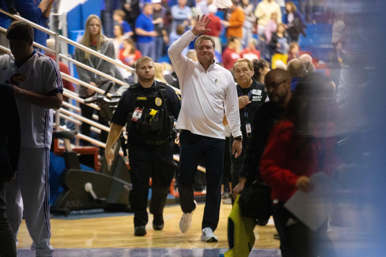 Kansas head coach Bill Self smiles and waves to fans as he exits the court to Allen Fieldhouse after beating Indiana earlier this season in December.