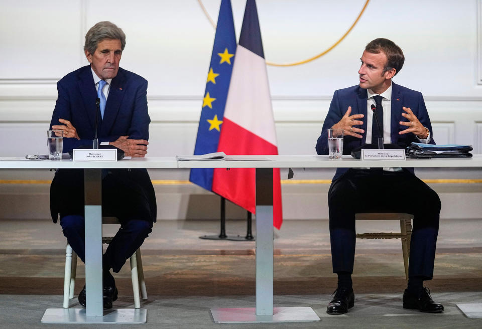 Kerry with French President Emmanuel Macron<span class="copyright">Michel Euler—POOL/AFP/Getty Images</span>